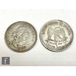 America - A replica 1804 Liberty dollar and a similar 1876 trade dollar. (2)