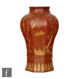 A Chinese late Qing Dynasty (1644-1912) Yixing vase, the octagonal meiping vase relief moulded to