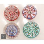 A collection of 20th Century Scottish glass paperweights, to include two with millefiori cartwheel