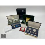 An Elizabeth II 1980 Isle of Mann Olympics coin, a 1974 Trinidad and Tobago eight proof coin set,