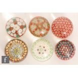 Six assorted glass paperweights, to include Murano and other examples, each with millefiori canes in