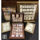 A collection of fifteen frames of mounted cigarette cards, various sets by Chairmans, Wills to