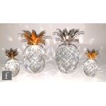 A group of Swarovski crystal ornaments comprising large gold plated pineapple, large silver plated