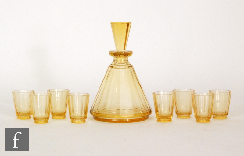 A 1930s Czechoslovakian Art Deco liqueur set with a slice cut conical bottle with matched stopper