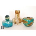 A group of three Mdina glass vases, comprising a jar of squat cylindrical form with conforming globe