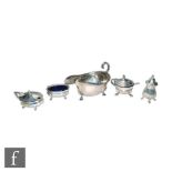 A hallmarked silver three piece cruet set of faceted boat shaped form with a similar mustard pot and