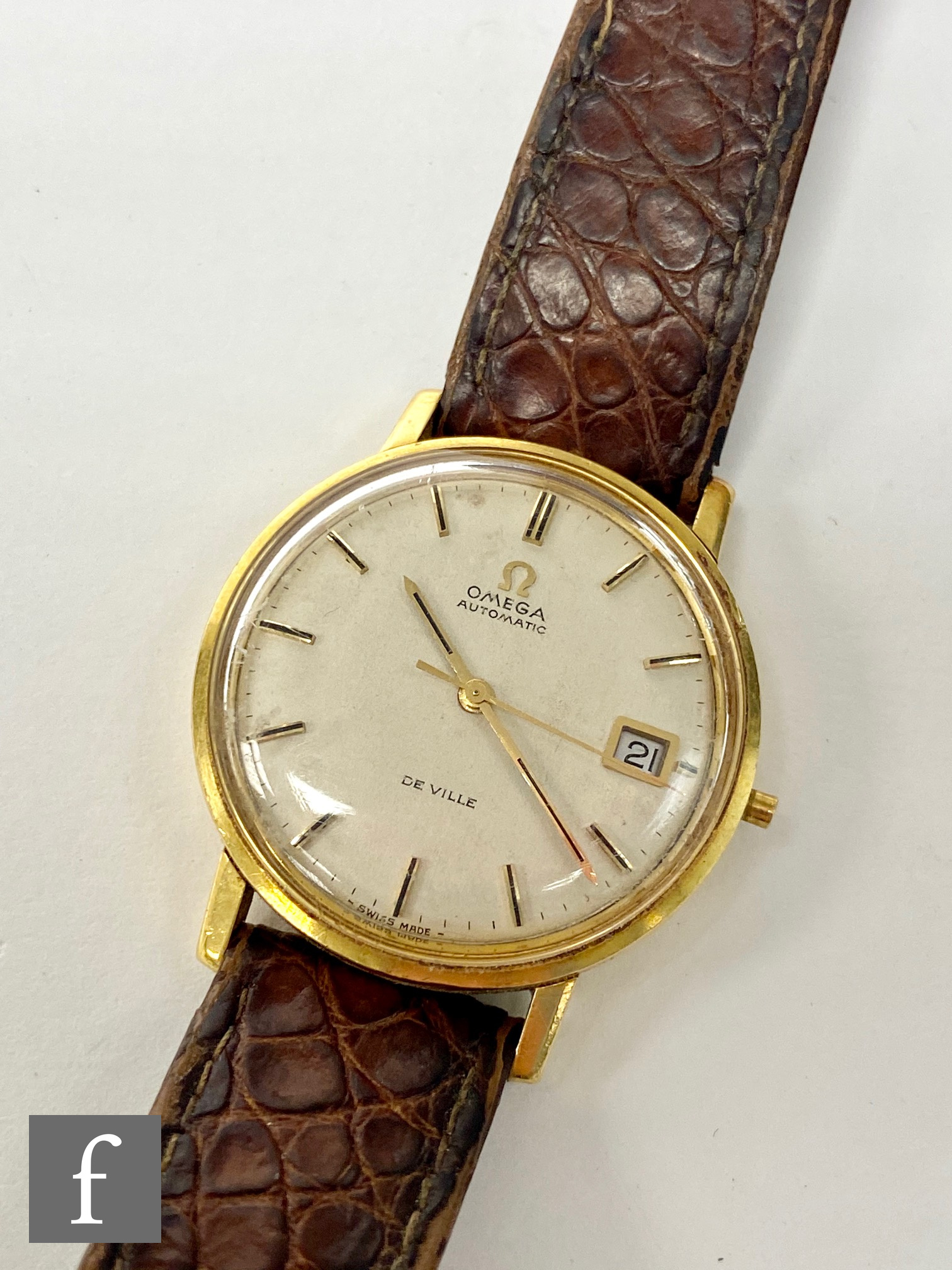 An Omega gentleman?s De Ville automatic wrist watch, the champagne coloured dial with baton numerals