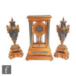 A late 19th Century French ormolu and champleve enamel clock garniture, the four glass clock with