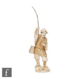 A Meiji Period (1868-1912) Japanese carved ivory okimono fisherman with catch holding a rod standing