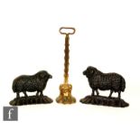 A pair of 19th Century cast iron door stops modelled as a ram and a ewe on naturalistic bases,