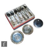 A cased set of six Chinese silver tea spoons, two pin dishes each with an inset Hong Kong dollar,
