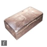 An Art Deco silver hallmarked cigarette box, of rectangular form with hinged cover revealing twin