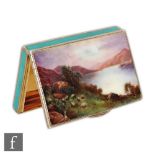 A hallmarked silver rectangular box with enamelled lakeland scene to hinged cover and green