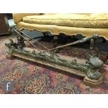 A late 19th to early 20th Century brass and steel fire fender with acanthus scroll detail,