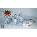 A group of Swarovski ornaments comprising gold plated large pineapple, bunch of grapes, pear and