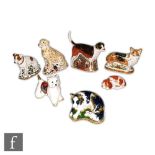 Eight Royal Crown Derby Dog paperweights to include Lurcher made exclusively for Sinclairs, numbered