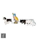 A Beswick Cockatoo shape 1180, impressed and printed mark, together with four Beswick pigs and a