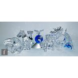 A collection of large Swarovski animal ornaments comprising Ibex Ram, Polar Bear, Bull, Cat, Dog,