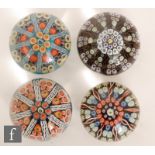 A group of four 20th Century Scottish glass paperweights, each decorated with a millefiori cartwheel