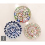 A collection of three 20th Century Scottish glass paperweights, to include an example with a