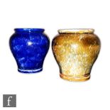 Two early 20th Century Royal Doulton cache pots, the first decorated in a mottled blue, the second a