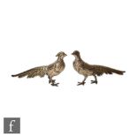 A pair of early 20th Century Continental silver table decorations each modelled as a standing