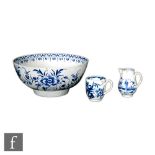 An 18th Century blue and white footed bowl decorated with floral sprays, diameter 23cm, together