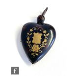 A Victorian heart shaped pique locket detailed with a vacant shield cartouche within a foliate