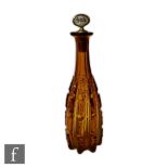 A 19th Century continental bottle form decanter of deep ribbed form with cross and printie