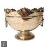 An Irish hallmarked silver pedestal bowl, circular stepped base below plain body with twin lion mask