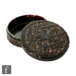 A 19th Century Chinese Canton carved tortoiseshell box, of circular form, with two integrated