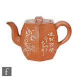 A Chinese Yixing teapot of rounded hexagonal form with loop handle, the exterior sides painted