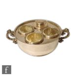 A hallmarked silver three section circular egg coddler of plain form with three egg holder and a