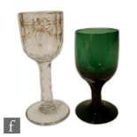 A late 18th Century wine glass circa 1785, the slice and facet cut bowl decorated with gilded