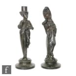 A pair of late French spelter figures, one modeled as gent smoking a cigar and wearing a top hat and