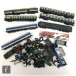 A collection of assorted OO and HO gauge locomotives and rolling stock, with railway scale vehicles,