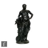 A 20th century bronze figure of a working blacksmith holding a mallet with pincers near his feet,