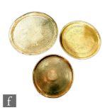 A collection of Middle Eastern/Persian style brass trays, all of circular from, some inscribed or