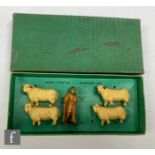 A Dinky Toys No. 6 Shepherd Set with shepherd and four sheep, with inner card piece in green lift