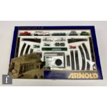 An N gauge Arnold 0301 Starter Train Set A+B, with DB Class 212 red diesel locomotive, four items of