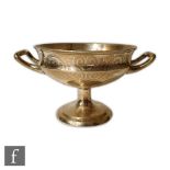 A Victorian hallmarked silver twin handled pedestal bowl with part line engraved decoration,