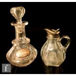 A 19th Century clear cut crystal decanter with slice cut body and ringed neck, together with a later