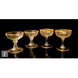 A set of six Daum Nancy fluted bowl champagne coupe with gilded rim plain stem and circular spread