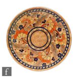 A 1930s Charlotte Rhead for Crown Ducal charger decorated in the Byzantine pattern with tubelined