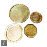 A collection of Middle Eastern/Indian brass trays, to include three circular form examples and an