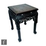 A Chinese late Qing Dynasty (1644-1912) Chinese Huanghuali style jardiniere stand, the low square