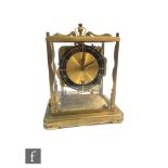 A 20th Century German mantle clock by Schatz, glass panel sides on plinth base, height 26cm.