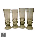 A set of four 19th century tall pale green beakers in the Roemer style with applied trailing and