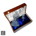 An early 20th Century boxed decanter formed as a thistle with hob nail and mitre cut decoration, the