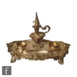 A Victorian hallmarked silver desk stand of cushioned rectangular form with acanthus leaf border and
